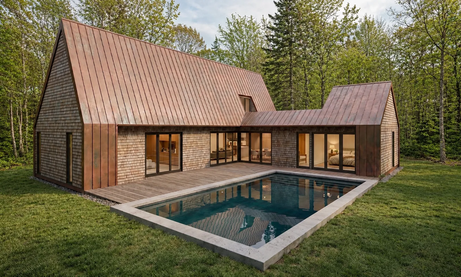 Cedar-shingle East Hampton home with a copper standing-seam roof wrapped around a pool and wood deck in a pine forest
