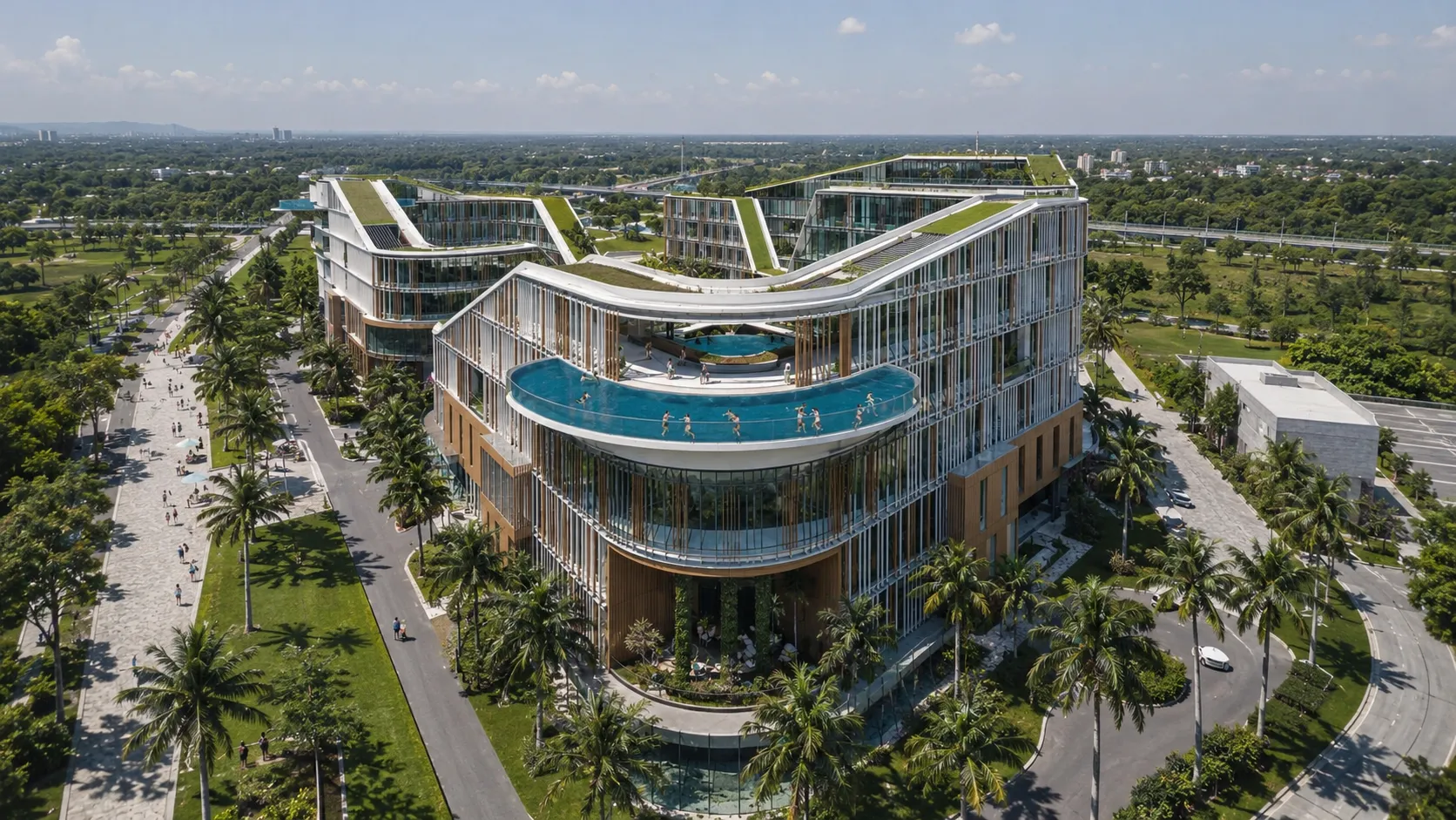 Aerial view of a serpentine green-roofed resort with a cantilevered infinity pool and a palm-lined boulevard 