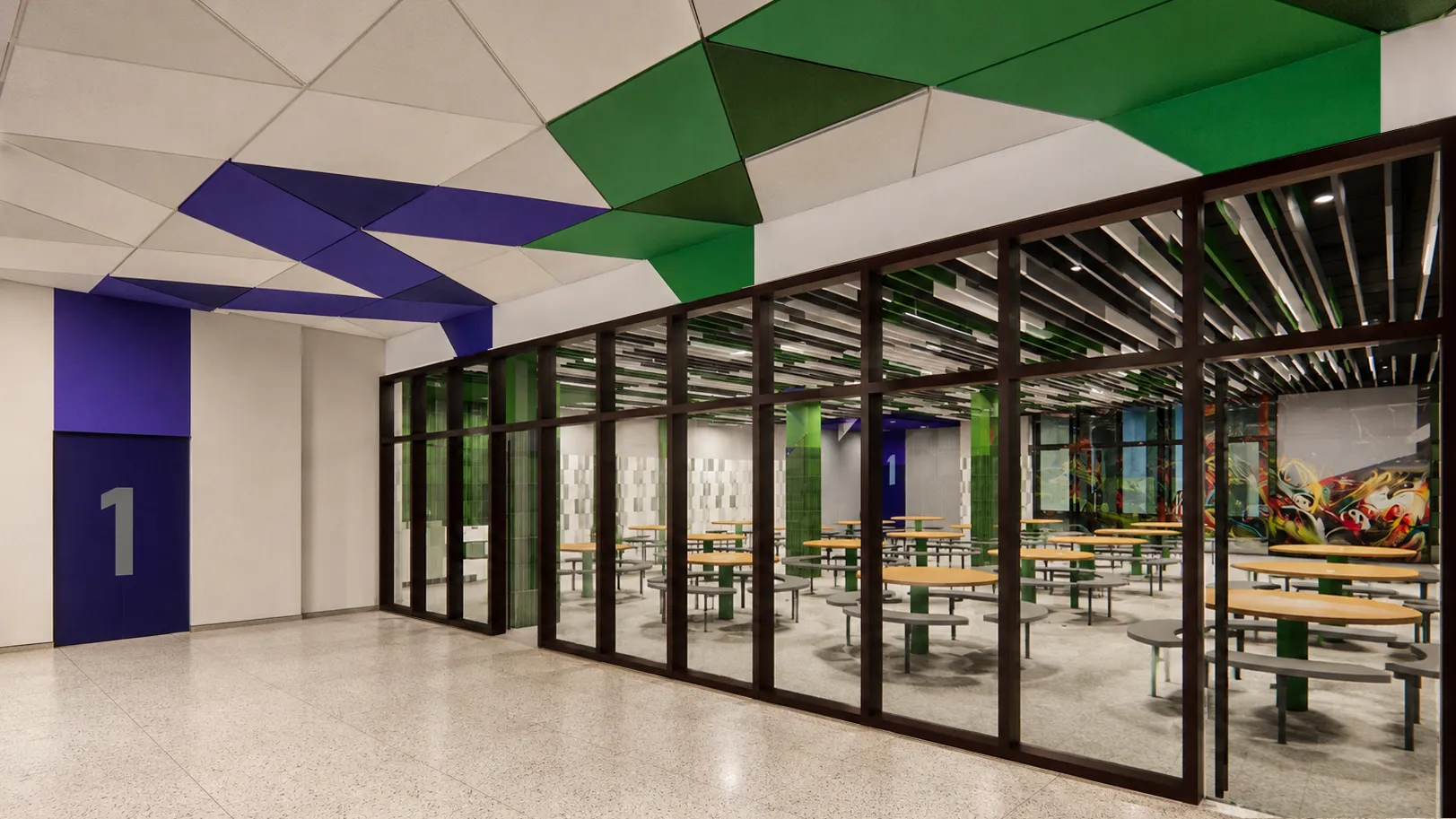 School corridor with a multicolor geometric ceiling looking through glass into a cafeteria in a Bronx, New York school