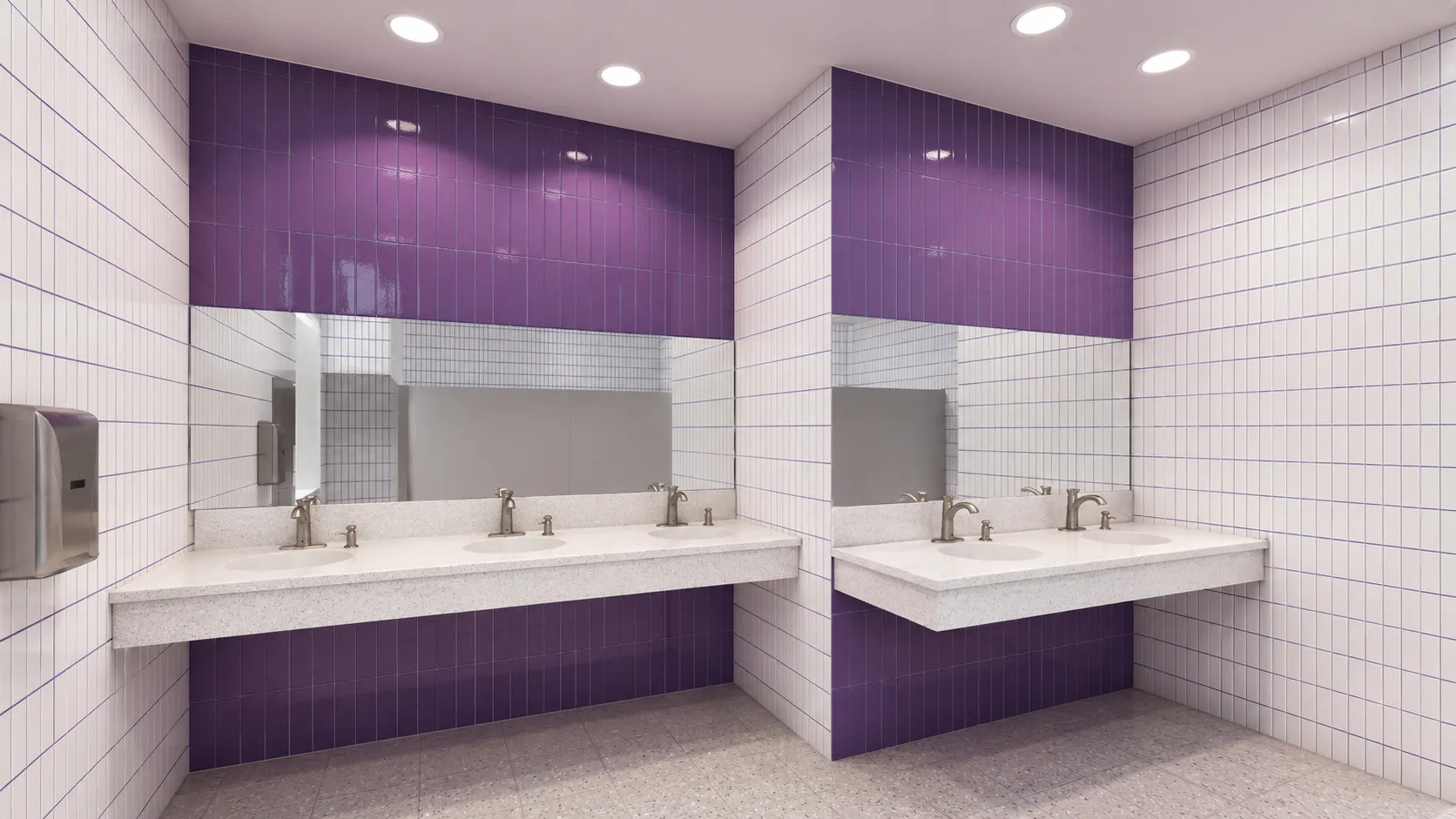 School restroom with white and purple tile and a terrazzo counter with several sinks in a Bronx, New York school